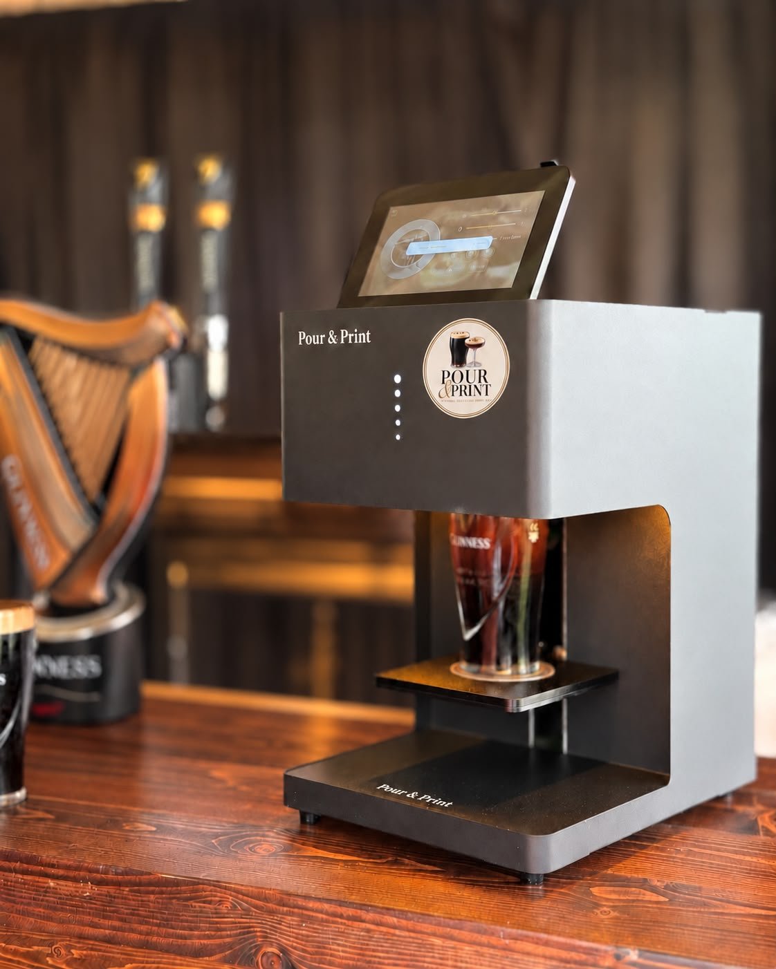 Pour & Print drink printer set up on a bar